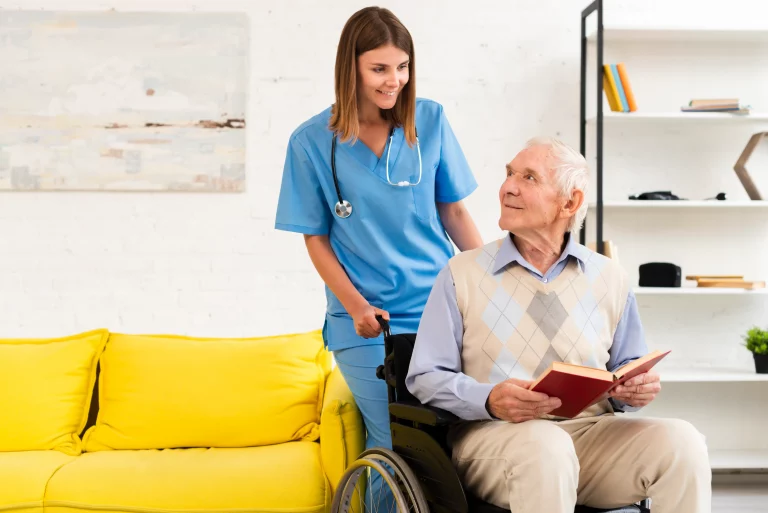 old man sitting wheelchair while talking nurse
