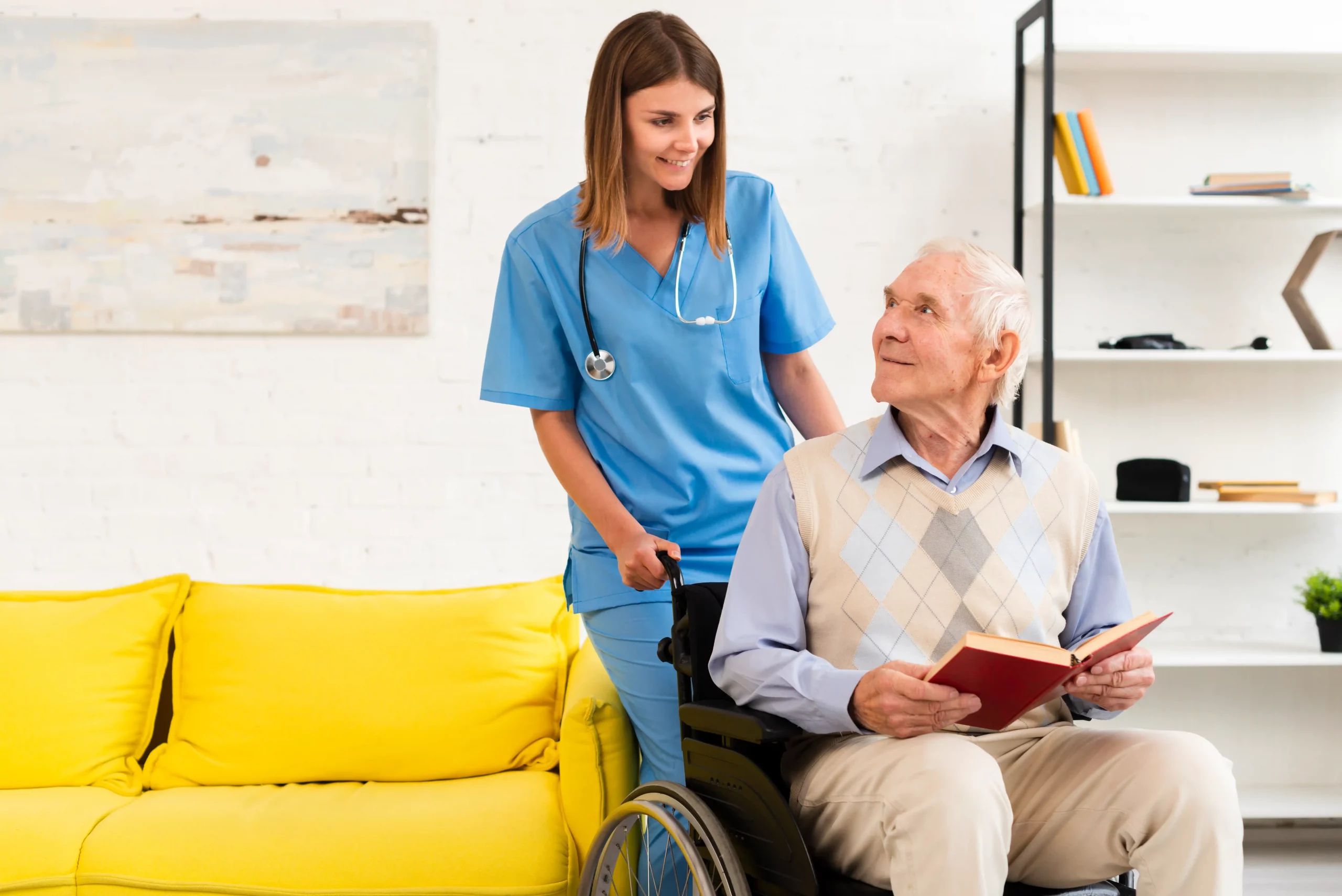 old man sitting wheelchair while talking nurse